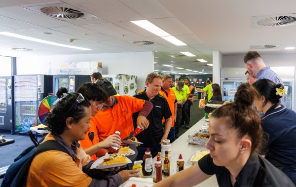 Oxworks staff lined up to receive a bbq lunch
